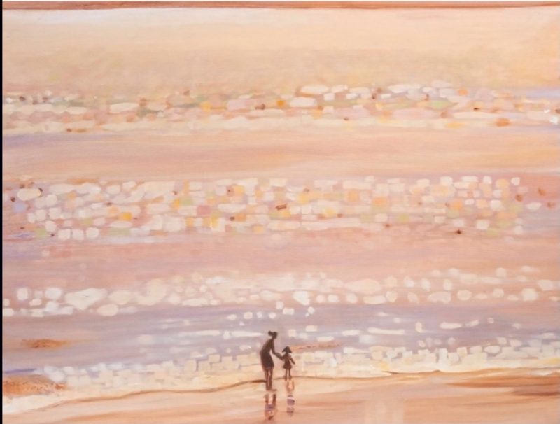 The sea at sunset over the beach, everything is washed with a golden hue, and warmth, in the light and dark in the shadows