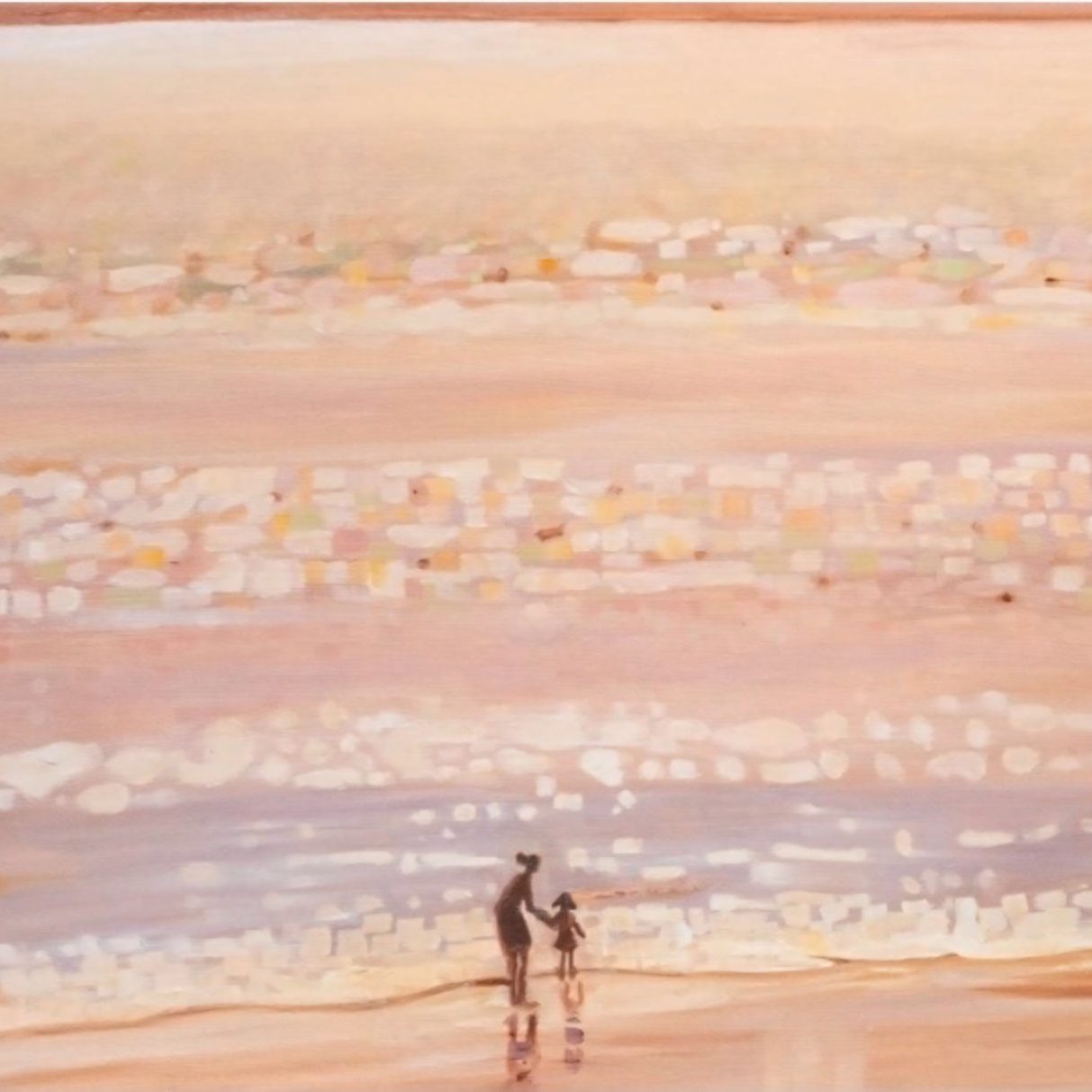 The sea at sunset over the beach, everything is washed with a golden hue, and warmth, in the light and dark in the shadows